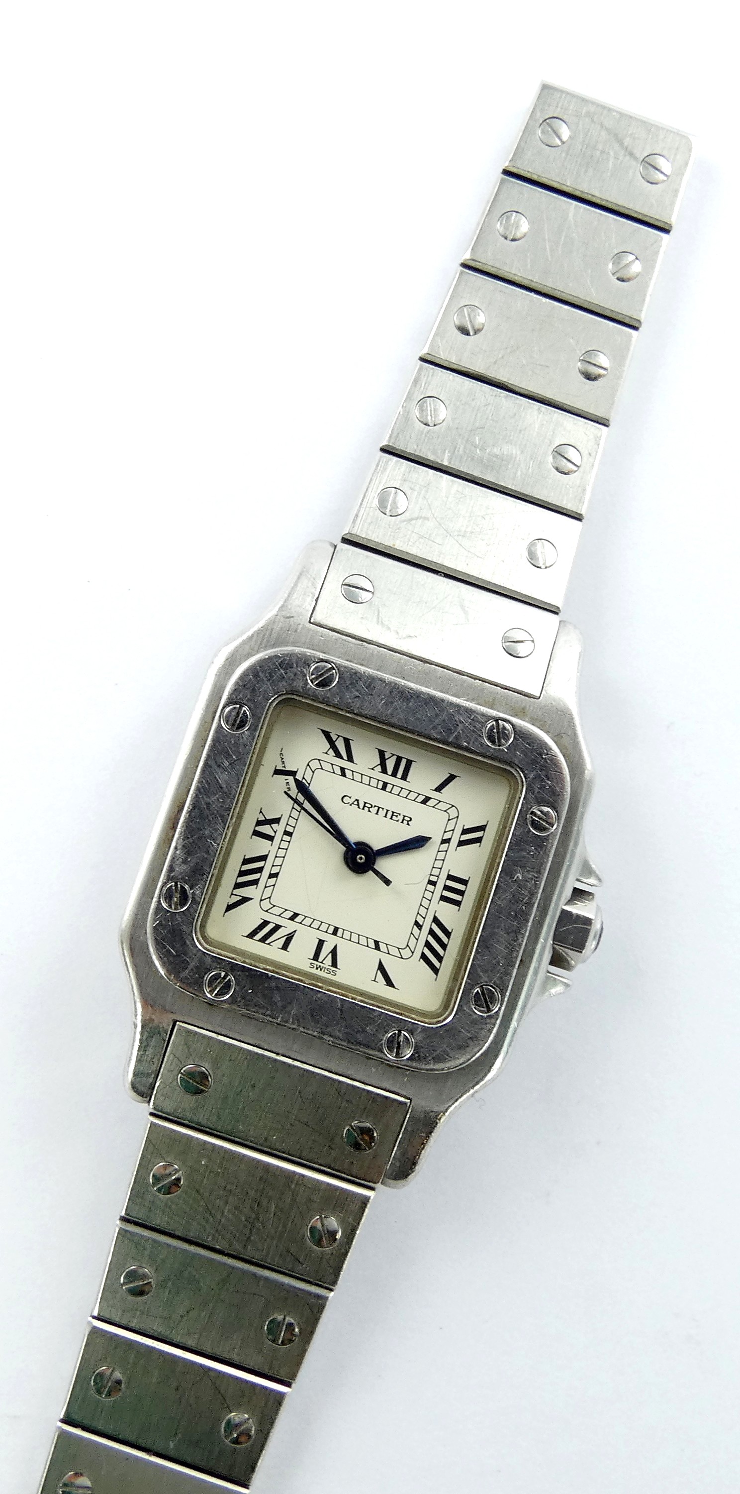 Lot 10 — CARTIER modéle Santos : Montre carrée Acier, sur fond blanc,